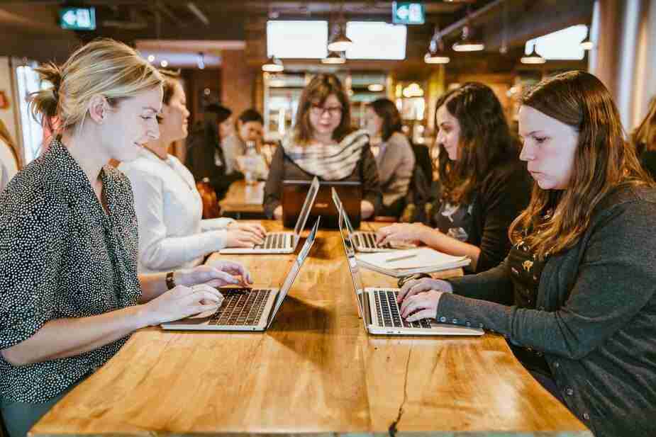 women-on-laptops-around-table.jpg